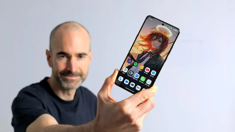 A simple phone review image with a reviewer and a phone on a light background.